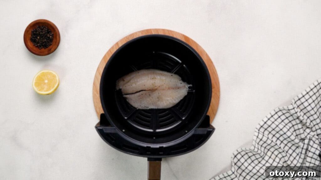 Crispy Air-Fried Tilapia with Zesty Garlic Butter 8 Tilapia fillet in air fryer basket