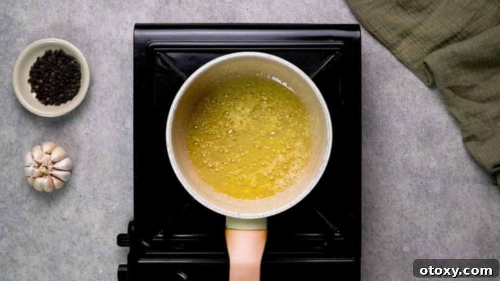Melted butter with garlic cooking in the pan