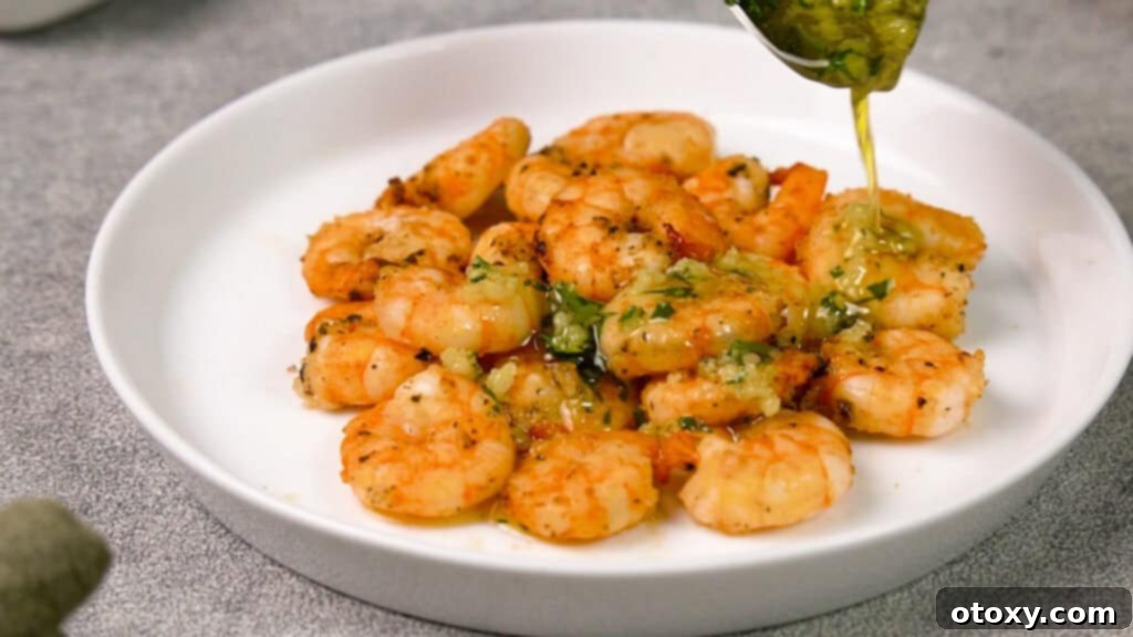 Cooked shrimp with garlic butter sauce on a plate