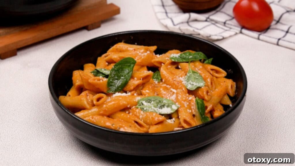A finished plate of Gigi Hadid Pasta, garnished with fresh basil leaves, ready to be served.