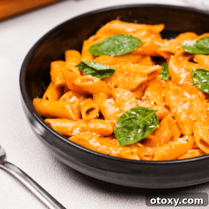 Gigi Hadid Pasta, a vibrant dish with creamy pink sauce and fresh basil.