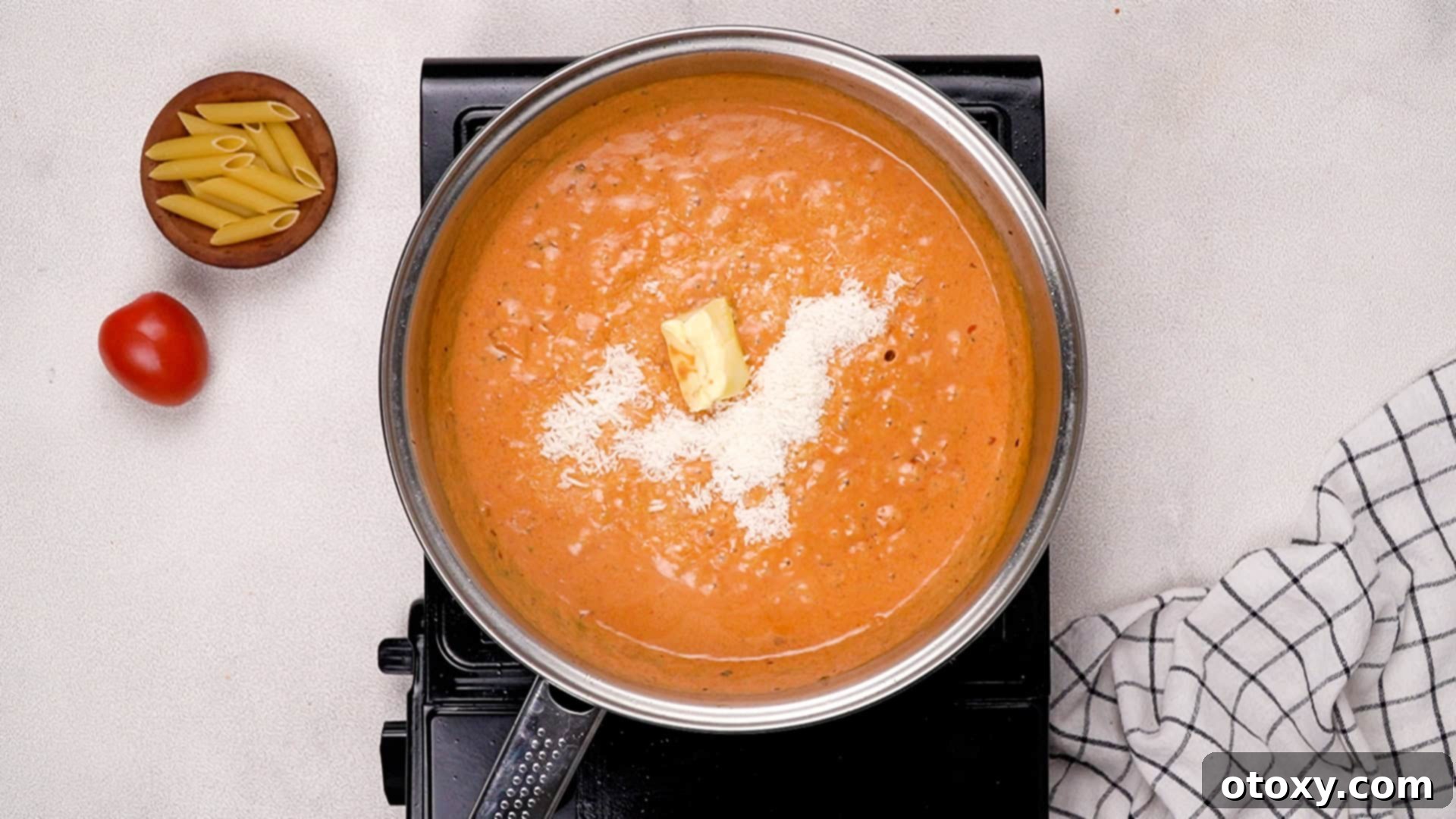Parmesan and butter melting in sauce.