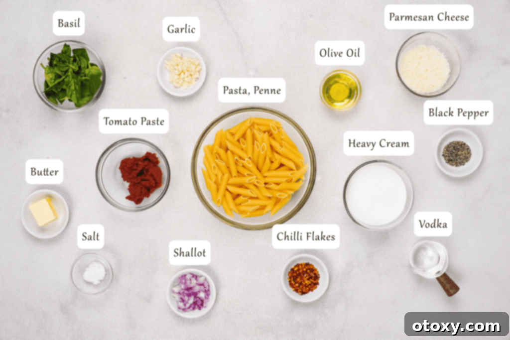A selection of fresh ingredients including olive oil, garlic, shallots, tomato paste, heavy cream, chili flakes, salt, pepper, Parmesan cheese, and fresh basil, ready for making Gigi Hadid Pasta.