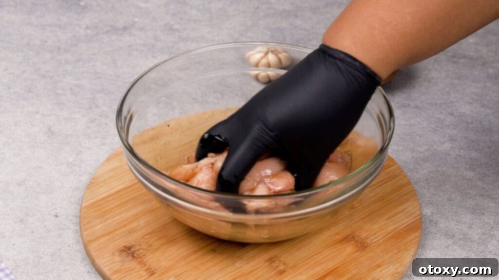 Seasoned chicken strips in a bowl