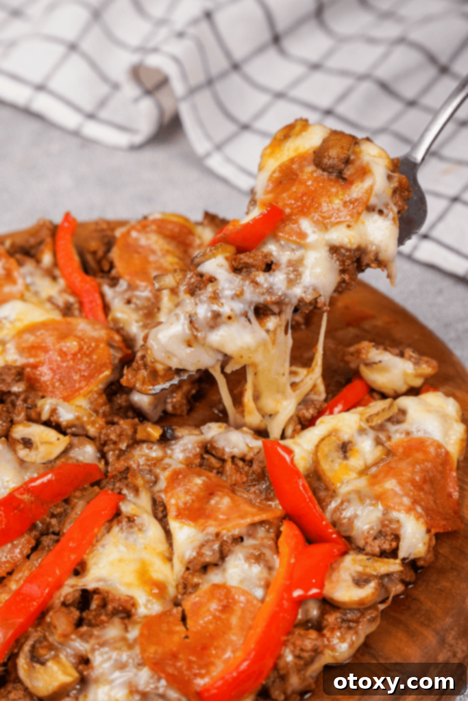 A freshly baked, hot crustless pizza, bubbling with melted cheese and vibrant toppings, ready to be served.