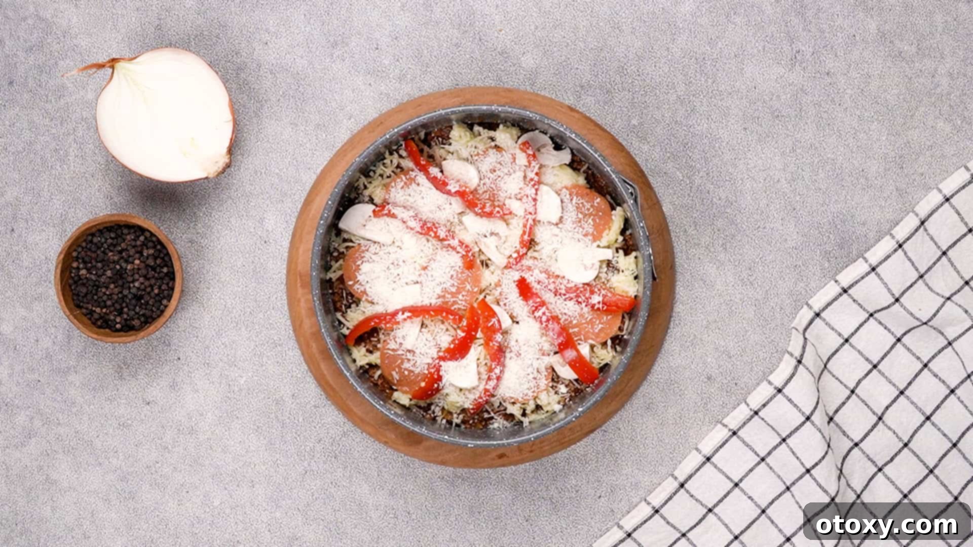 Adding Parmesan cheese