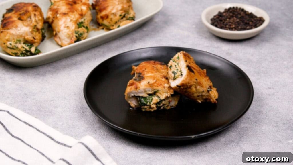 Plated golden-brown stuffed chicken breast, ready to be served.