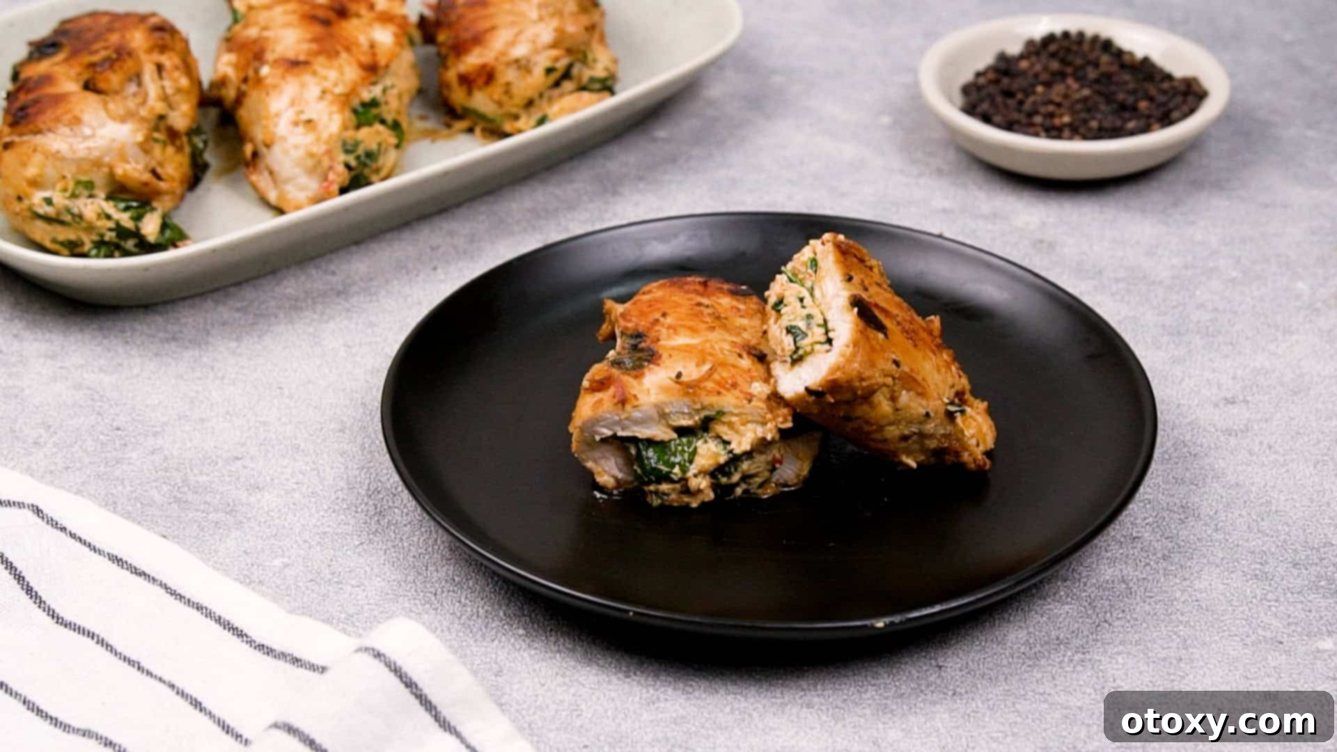 Resting cooked stuffed chicken breast before serving.