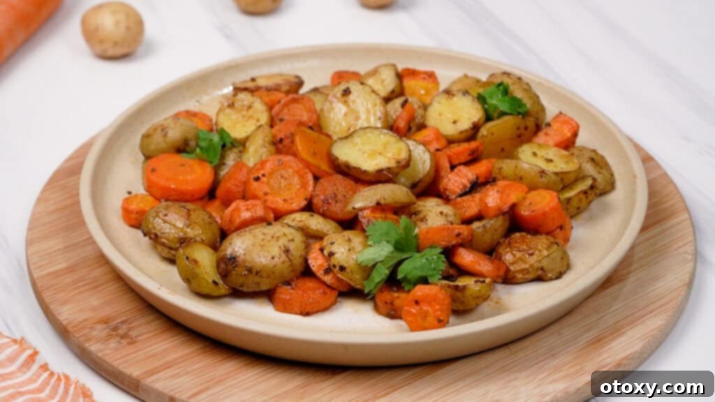 Herb Roasted Potatoes and Carrots 11 A plate of freshly roasted potatoes and carrots, ready to be served