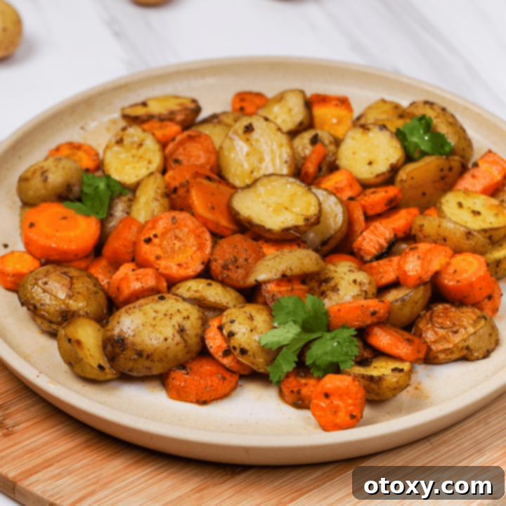 Herb Roasted Potatoes and Carrots 14 Roasted Potatoes and Carrots on a plate, ready to serve