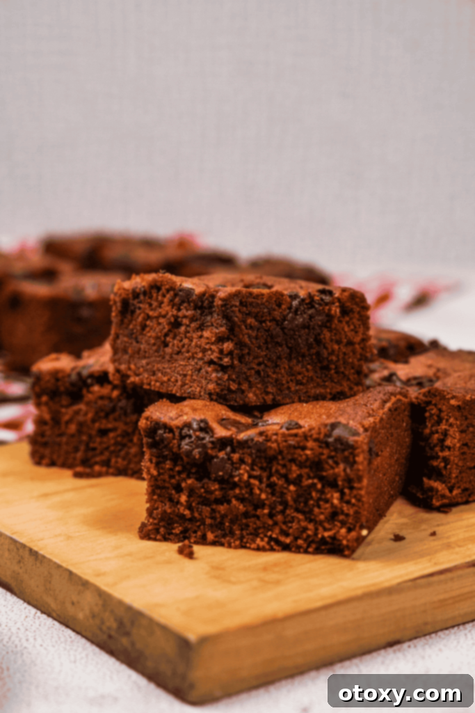 Stacked Nutella brownies with a dusting of cocoa powder