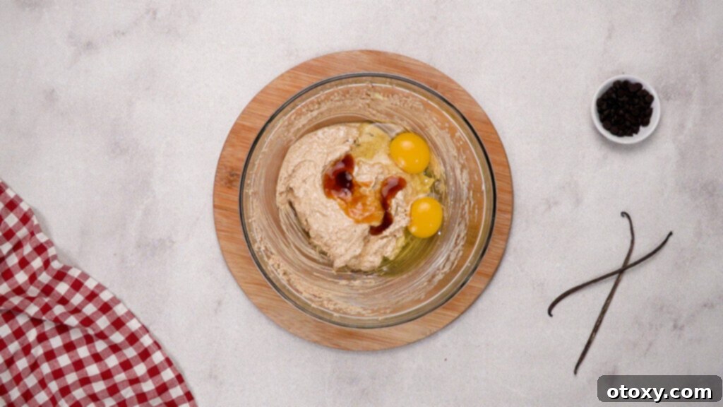 Eggs and vanilla extract added to brownie batter