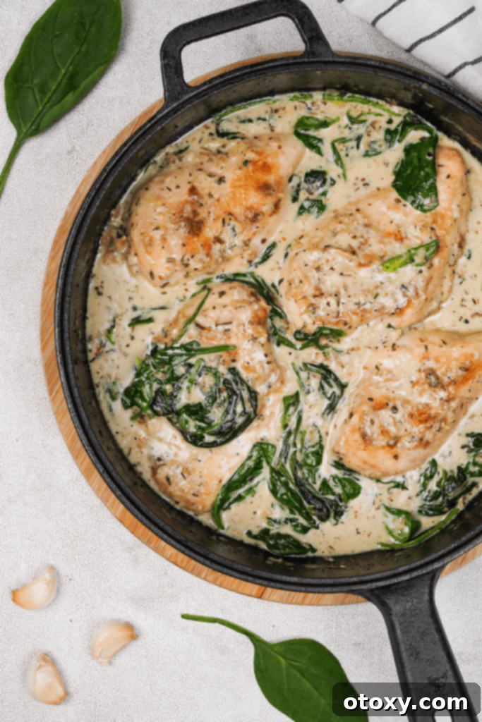 Chicken Florentine served in a cast iron skillet