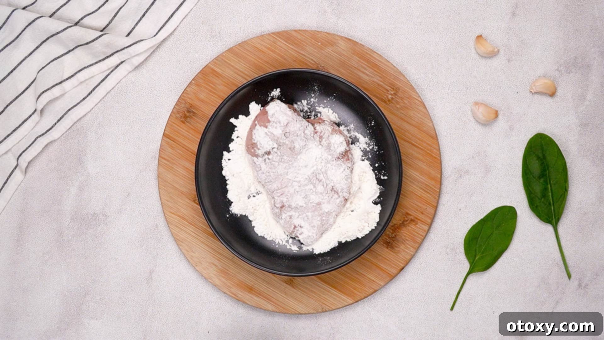 Dredging chicken in flour