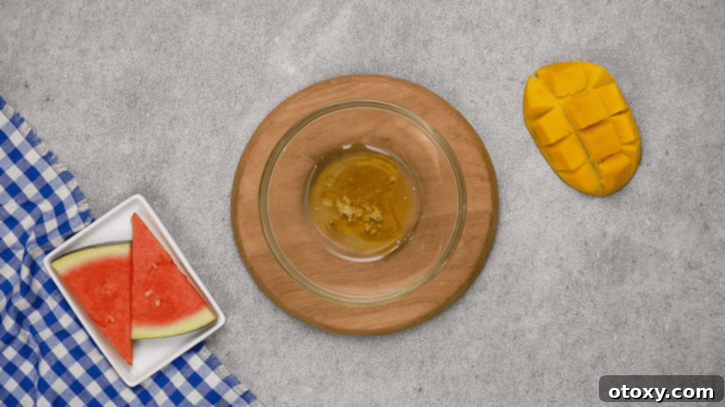 Watermelon Feta Summer Bliss 5 Whisking honey, lime juice, olive oil, and salt for the dressing in a small bowl.
