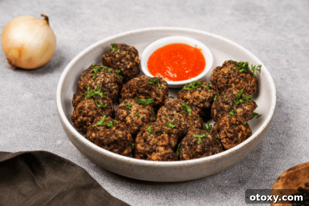 Crispy, Juicy Air Fryer Meatballs 2 Crispy, juicy homemade Air Fryer Meatballs on a platter