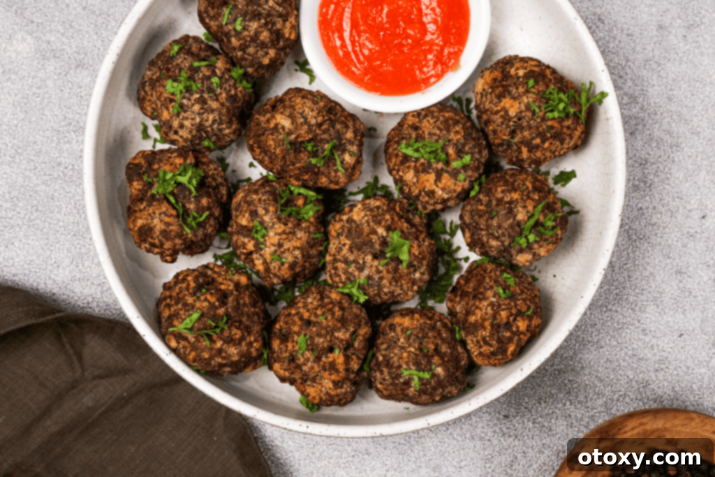 Crispy, Juicy Air Fryer Meatballs 12 Platter of golden brown Air Fryer Meatballs ready to be served