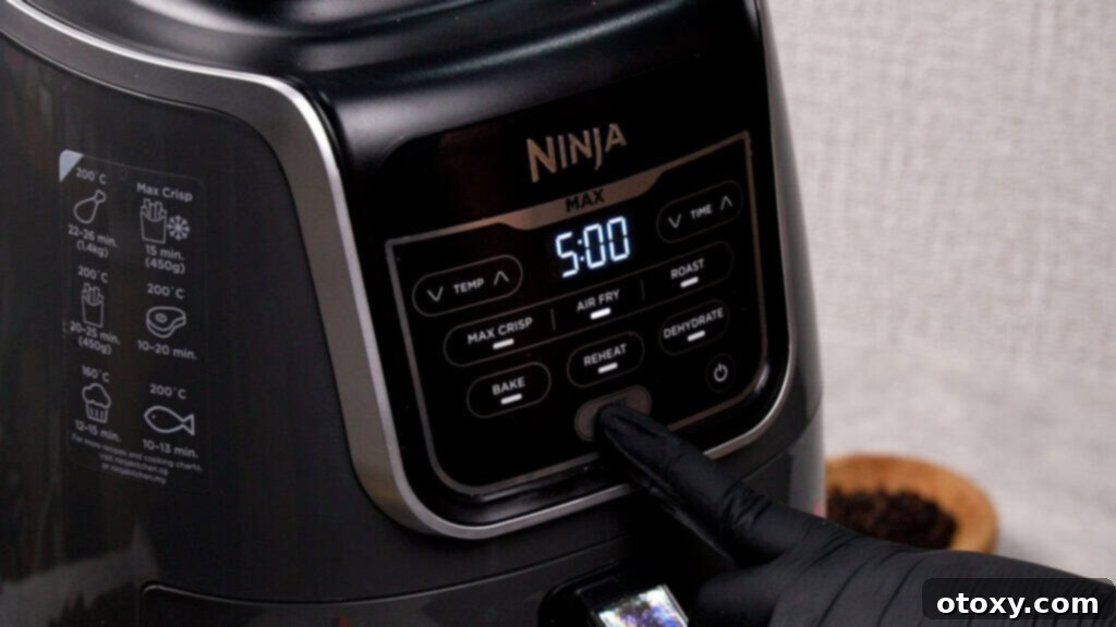 Crispy, Juicy Air Fryer Meatballs 4 Air fryer being preheated to optimal temperature for cooking meatballs