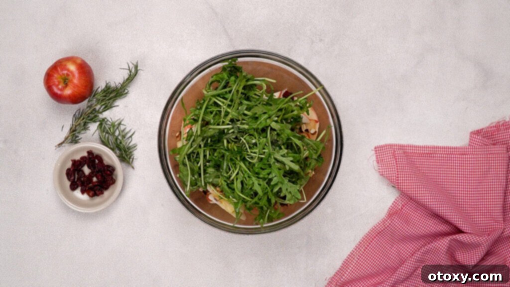 Orchard Fresh Apple Salad 7 Mixing fresh fruit and vegetables in a large salad bowl