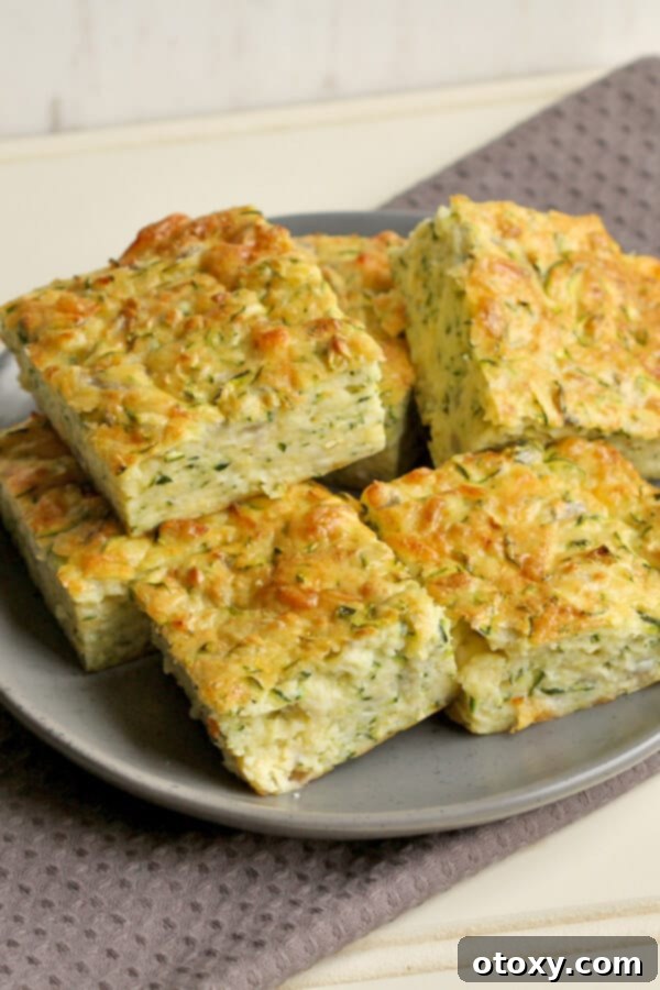 Pieces of healthy zucchini slice on a white plate