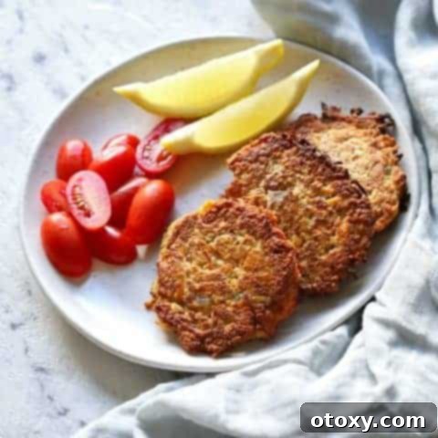Healthy Zucchini Fritters: Gluten-Free, Paleo and Whole30 10 Delicious gluten-free carrot and zucchini fritters on a white plate