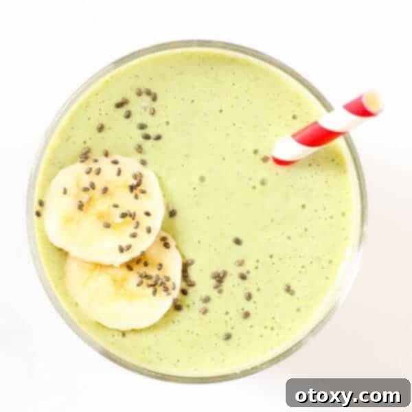 Delicious Green Smoothie in a glass, garnished with fresh mint