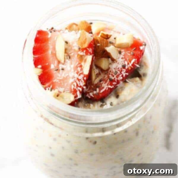 Jar of Healthy Overnight Oats topped with fresh berries