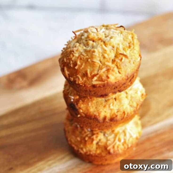 Freshly baked Banana Coconut Muffins with golden tops