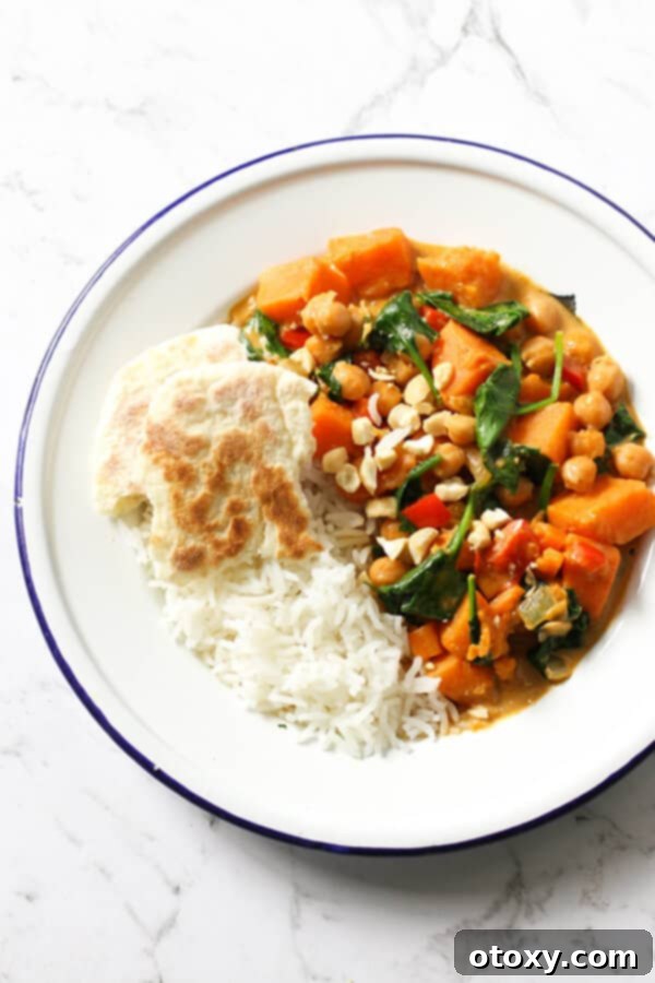 Wholesome Sweet Potato, Chickpea, and Spinach Curry 2 sweet potato, chickpea and spinach curry in a bowl with rice