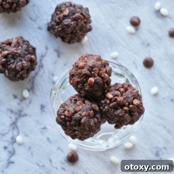 a bunch of healthy chocolate crackles in a glass cup