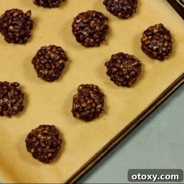 healthy chocolate crackles rolled into balls on a baking tray 