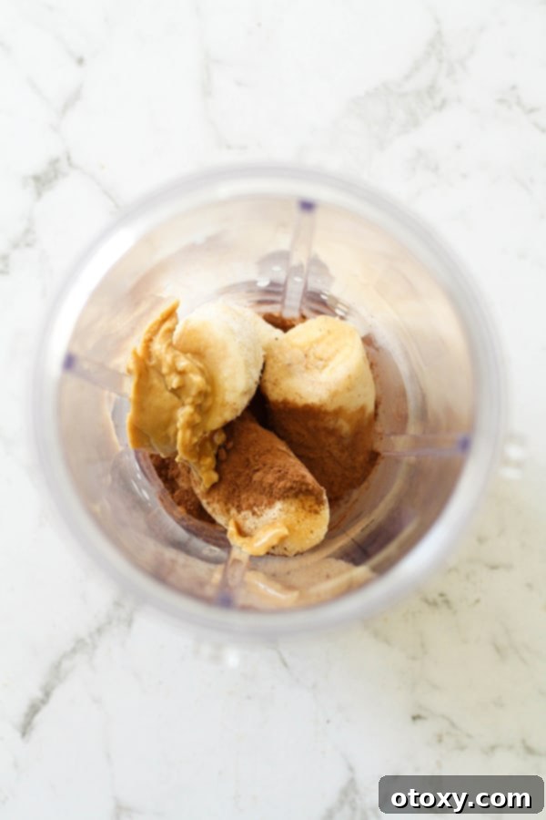 Nice cream ingredients carefully placed in a high-performance blender cup, ready for blending.