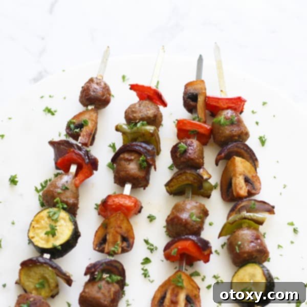 A collection of grilled sausage and vegetable skewers arranged on a serving platter, ready to be enjoyed as a wholesome and flavorful meal.