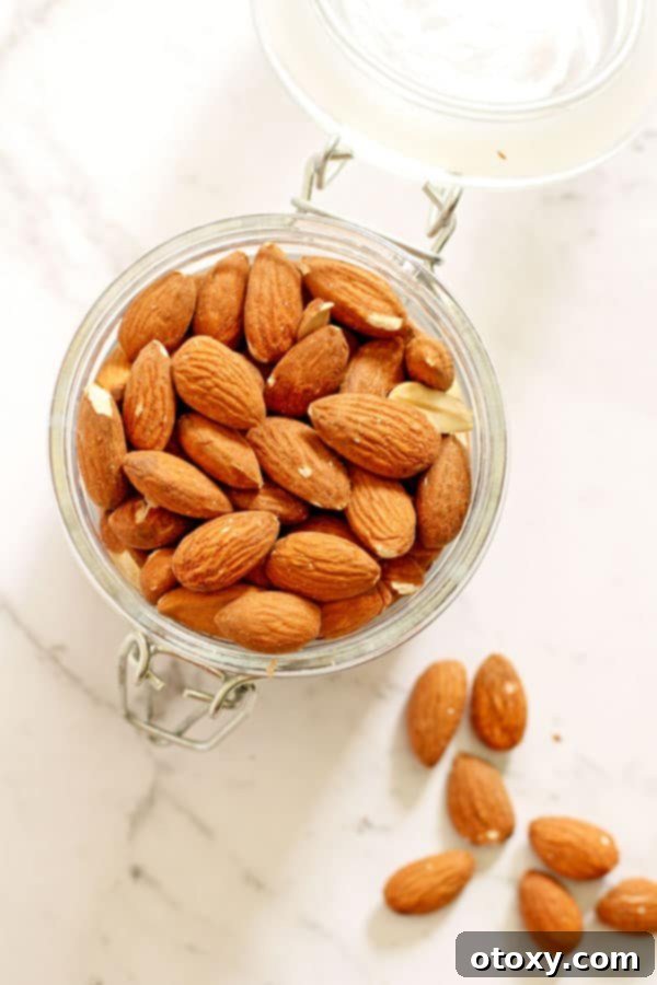 Close-up of chopped almonds in a glass jar, ready for use in a salad