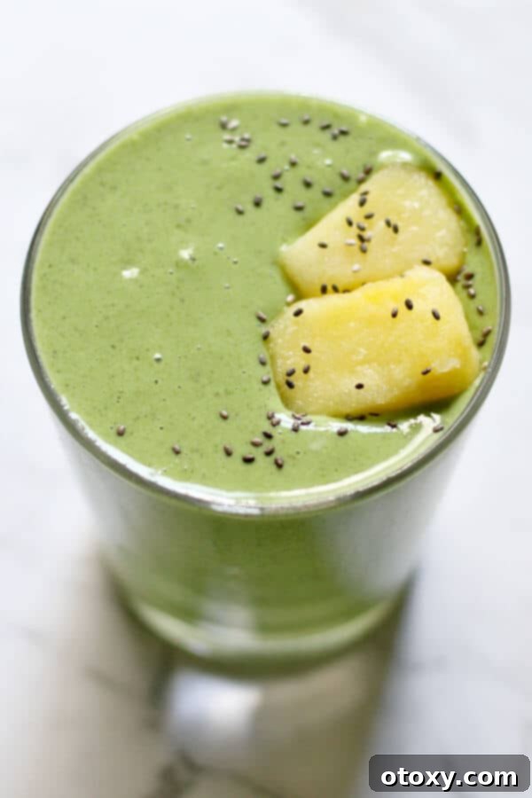 Tropical Kale Power Smoothie 2 Kale Pineapple Smoothie topped with pineapple pieces and chia seeds