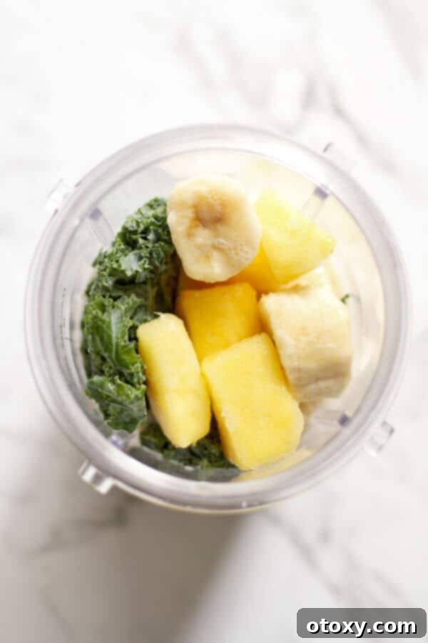Tropical Kale Power Smoothie 3 Kale Pineapple Smoothie ingredients in a blender cup