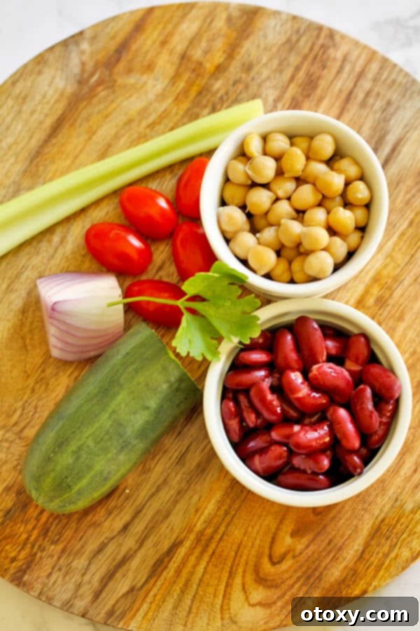 Zesty Two-Bean Power Salad 3 middle eastern bean salad ingredients on a chopping board