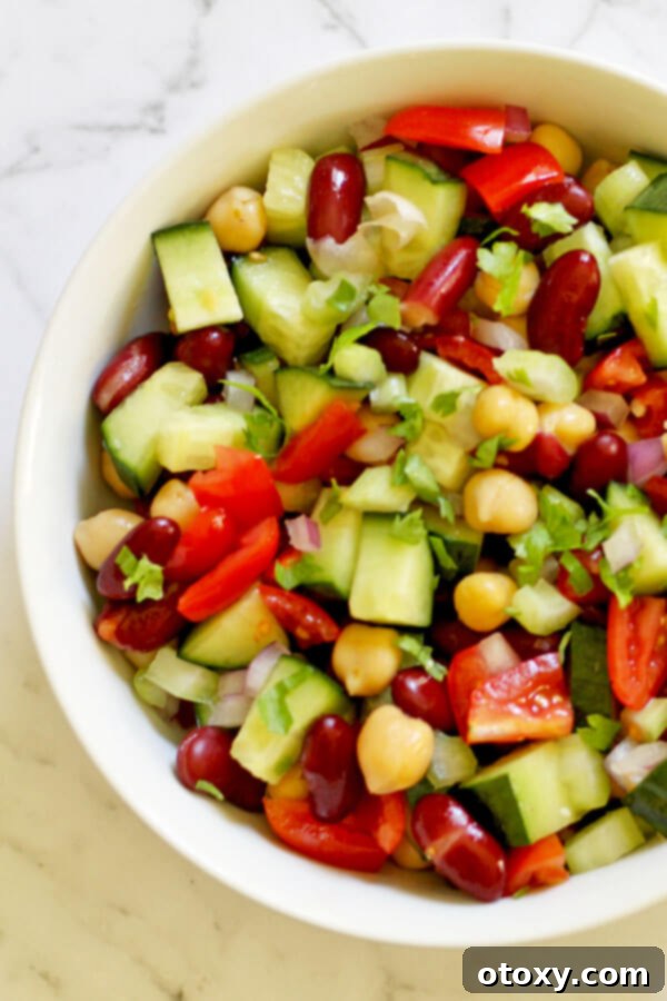 Zesty Two-Bean Power Salad 4 close up of middle eastern bean salad in a white bowl