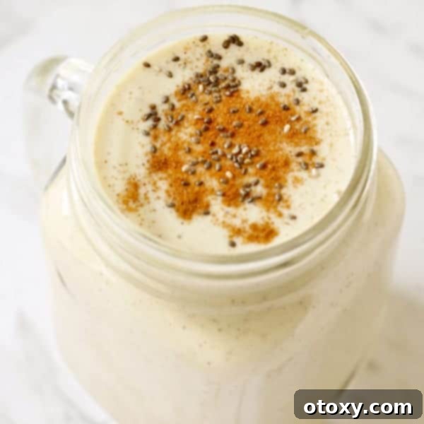 A close-up photograph of a creamy banana chia smoothie, highlighting its inviting texture and healthy ingredients, ready to be enjoyed.