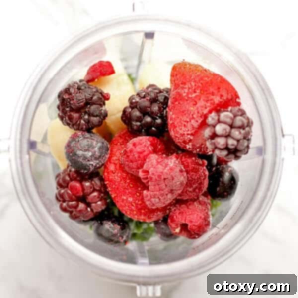 Close-up of vibrant berry smoothie ingredients, including fresh berries and yogurt, perfectly arranged and ready to be blended in a high-performance blender cup for a healthy smoothie.