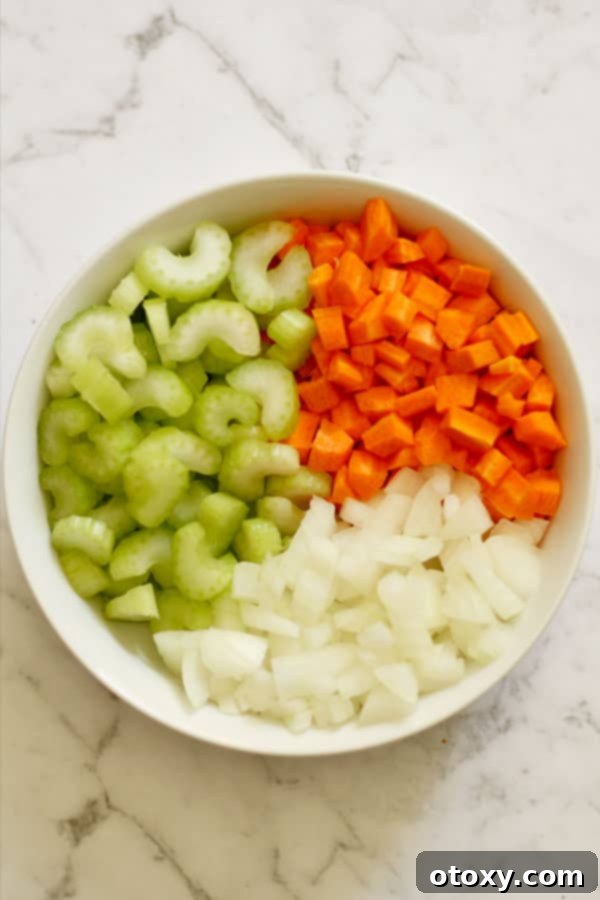 chopped carrot, celery and onion in a bowl