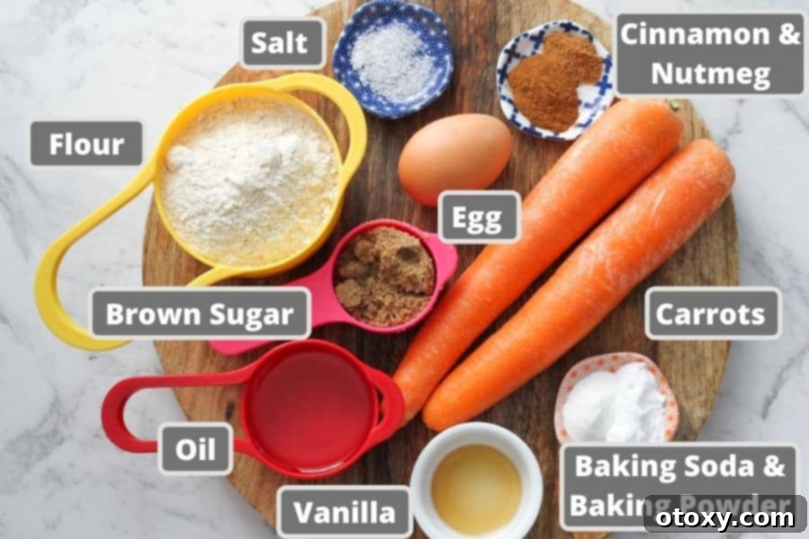 ingredients for carrot cupcakes on a wooden board.