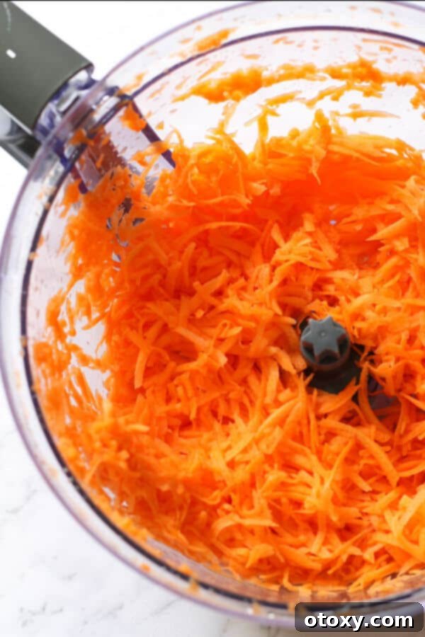 shredded carrots in a food processor