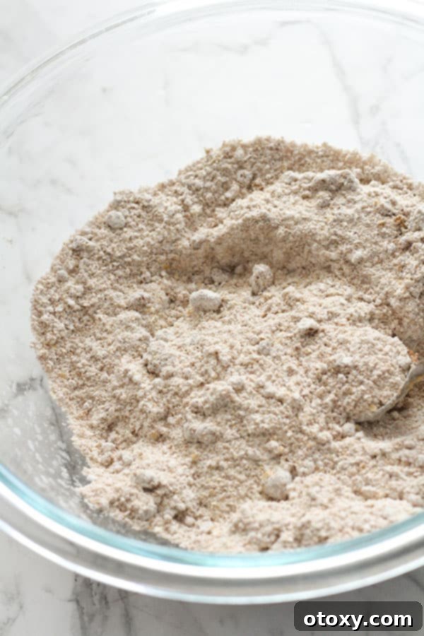 flour and sugar mixed together in a glass bowl.