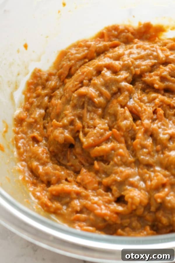 carrot cupcake mixture in a glass bowl.