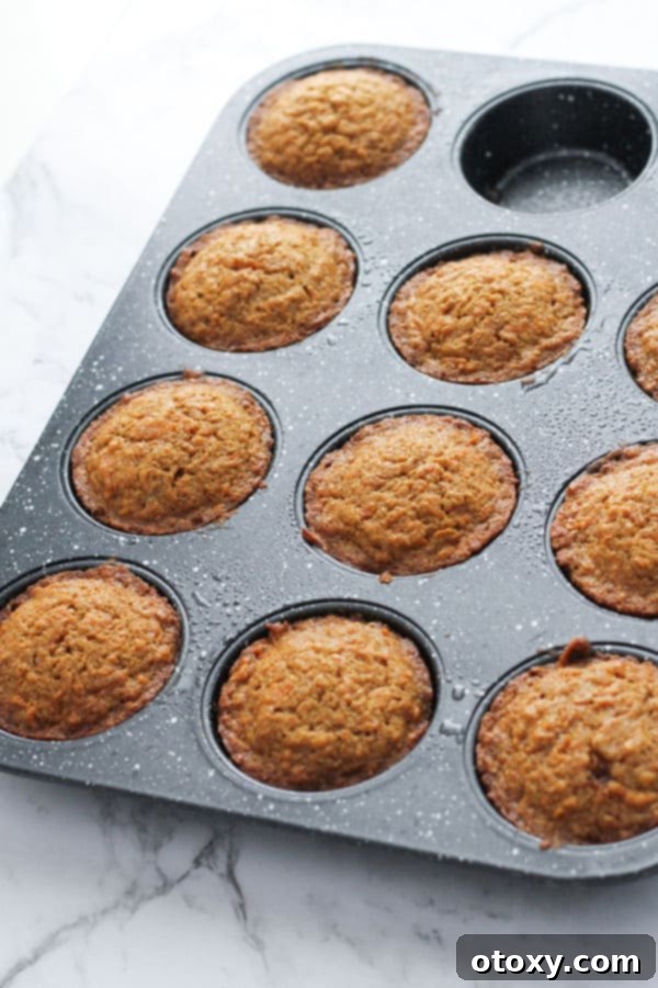 carrot cupcakes in a muffin tin.