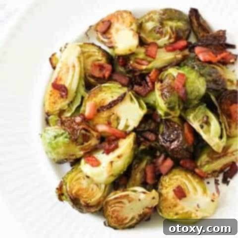 A beautifully plated dish of crispy roasted Brussels sprouts with bacon