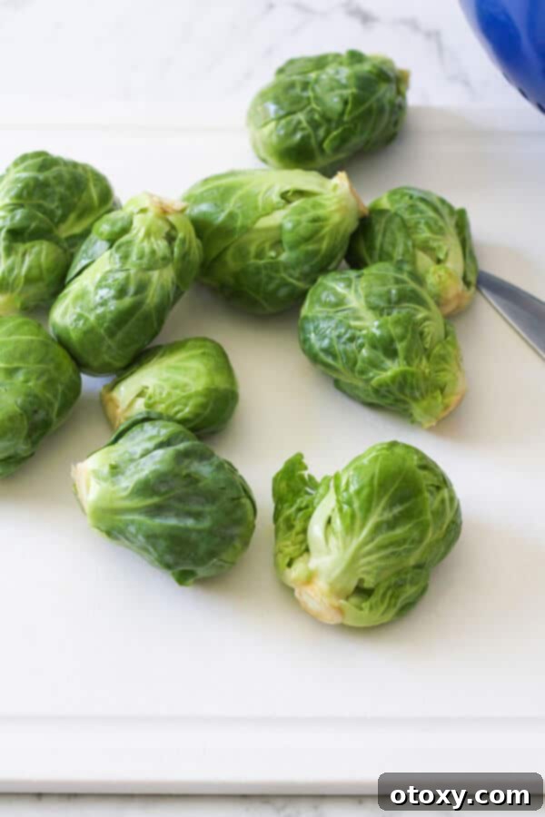brussels sprouts scattered on a cutting board