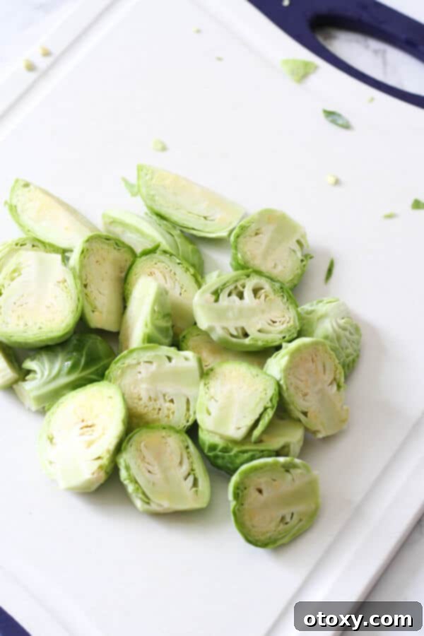 halved brussels sprouts on a cutting board