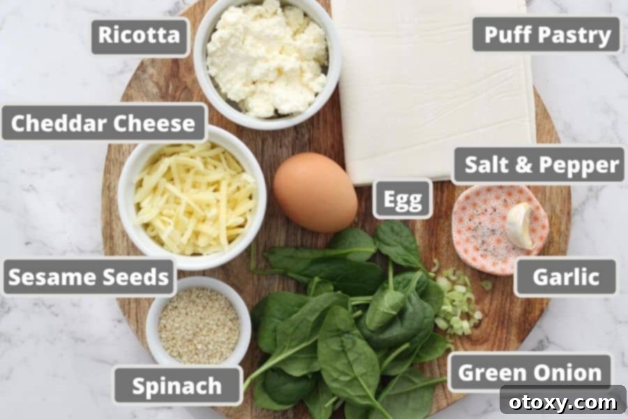 Spinach Ricotta Rolls Oven or Air Fried 4 Fresh ingredients for spinach and ricotta rolls neatly arranged on a rustic wooden board, including spinach, cheeses, and puff pastry.